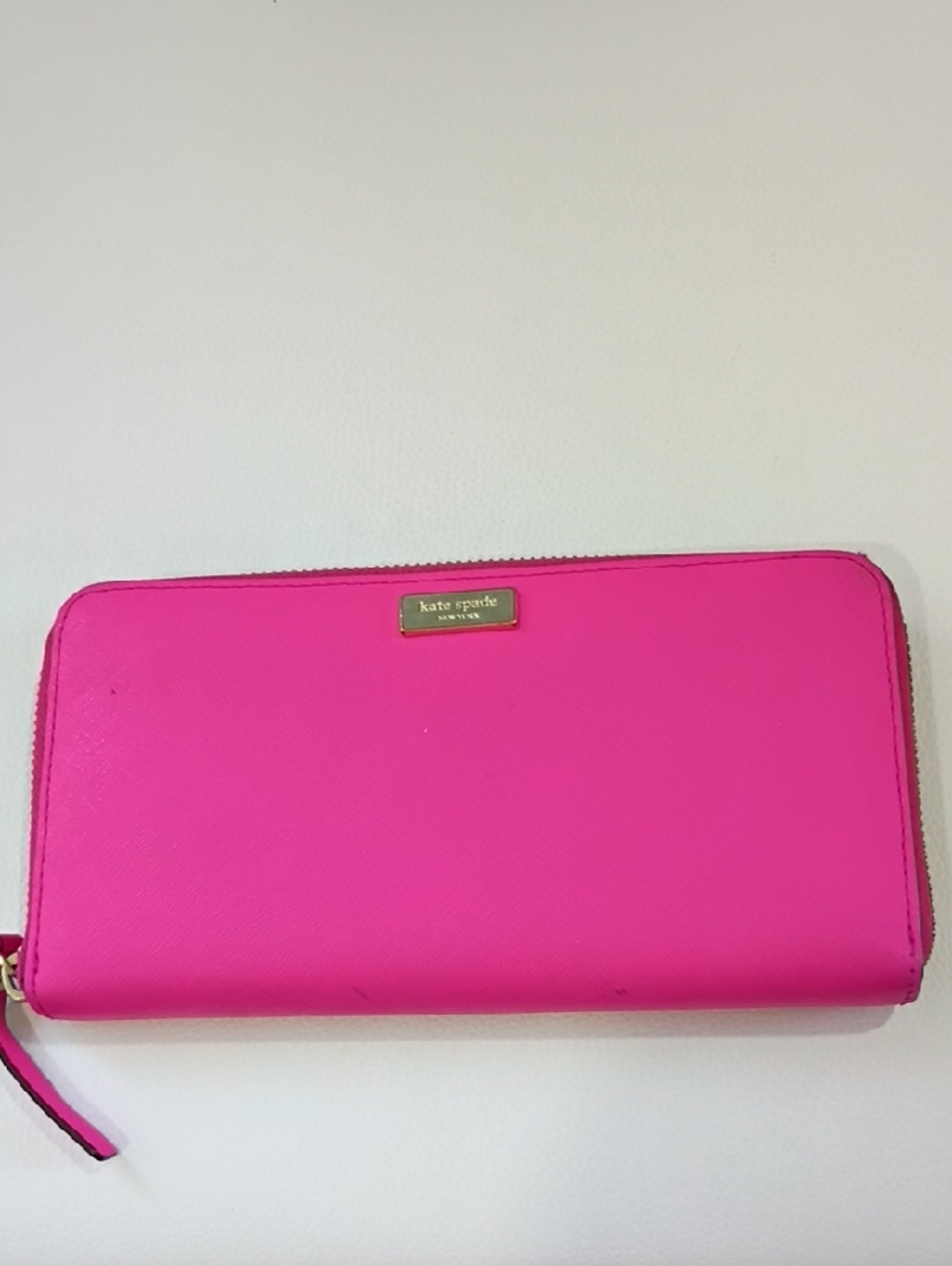 kate spade bright pink zip-around wallet with gold plaque